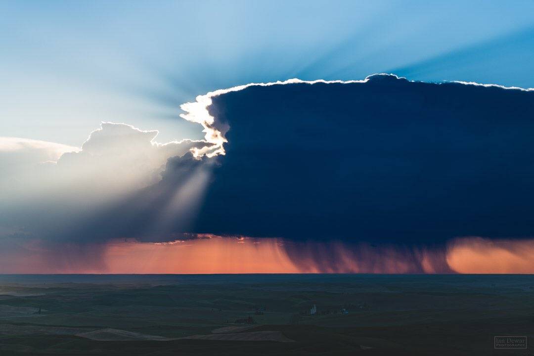 2nd Place Storm over Ritzville. Thunderstorm drifts across Eastern Washington as the sun sets by iandewarphotography @iandewarphoto