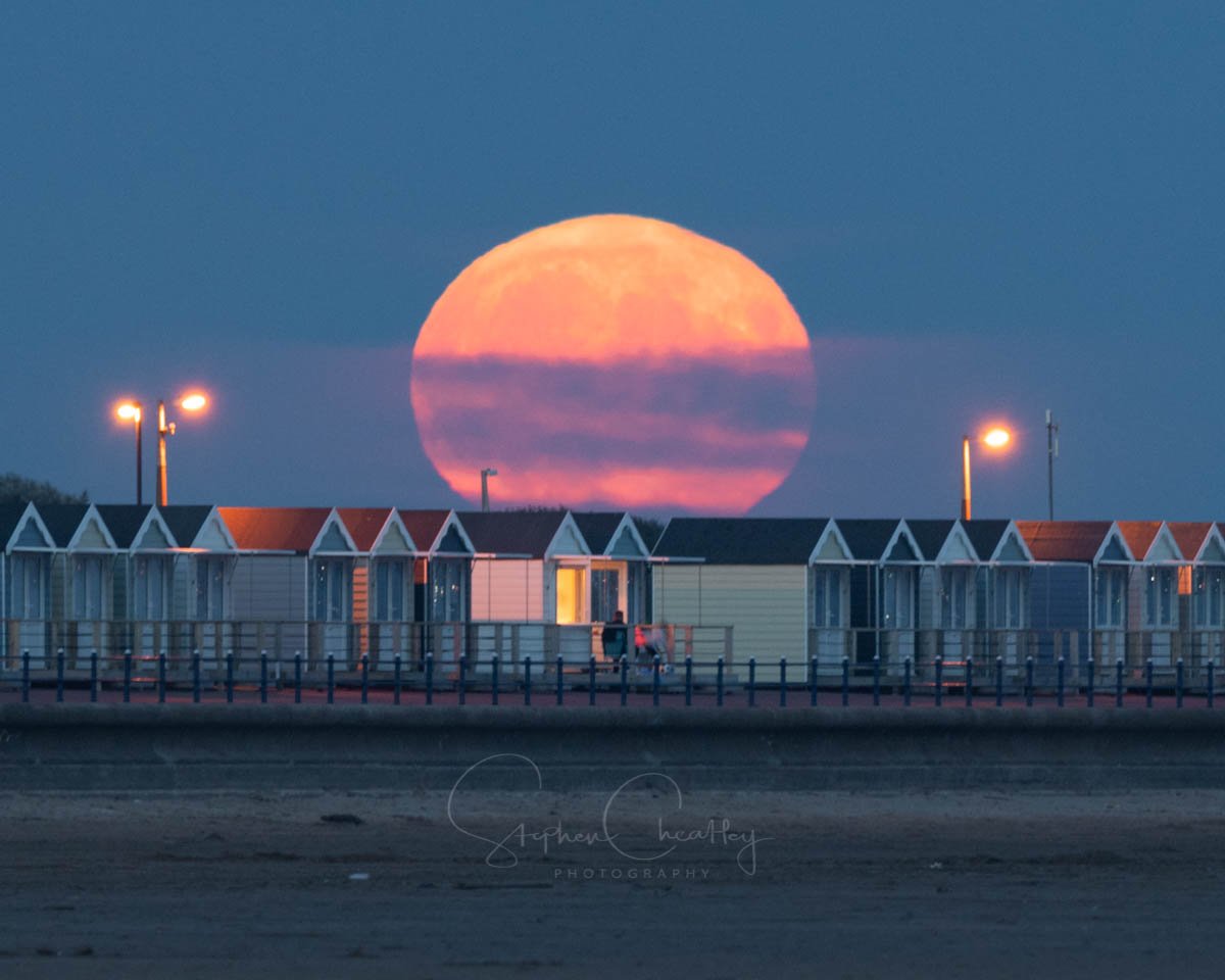Amazing Sturgeon moonrise over the famous Beach Huts at St Annes in Lancashire by Stephen Cheatley BFC @Stephencheatley