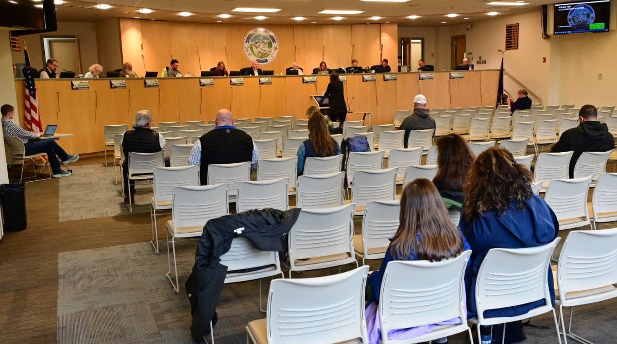 Residents attend a Matanuska-Susitna Borough Assembly hearing