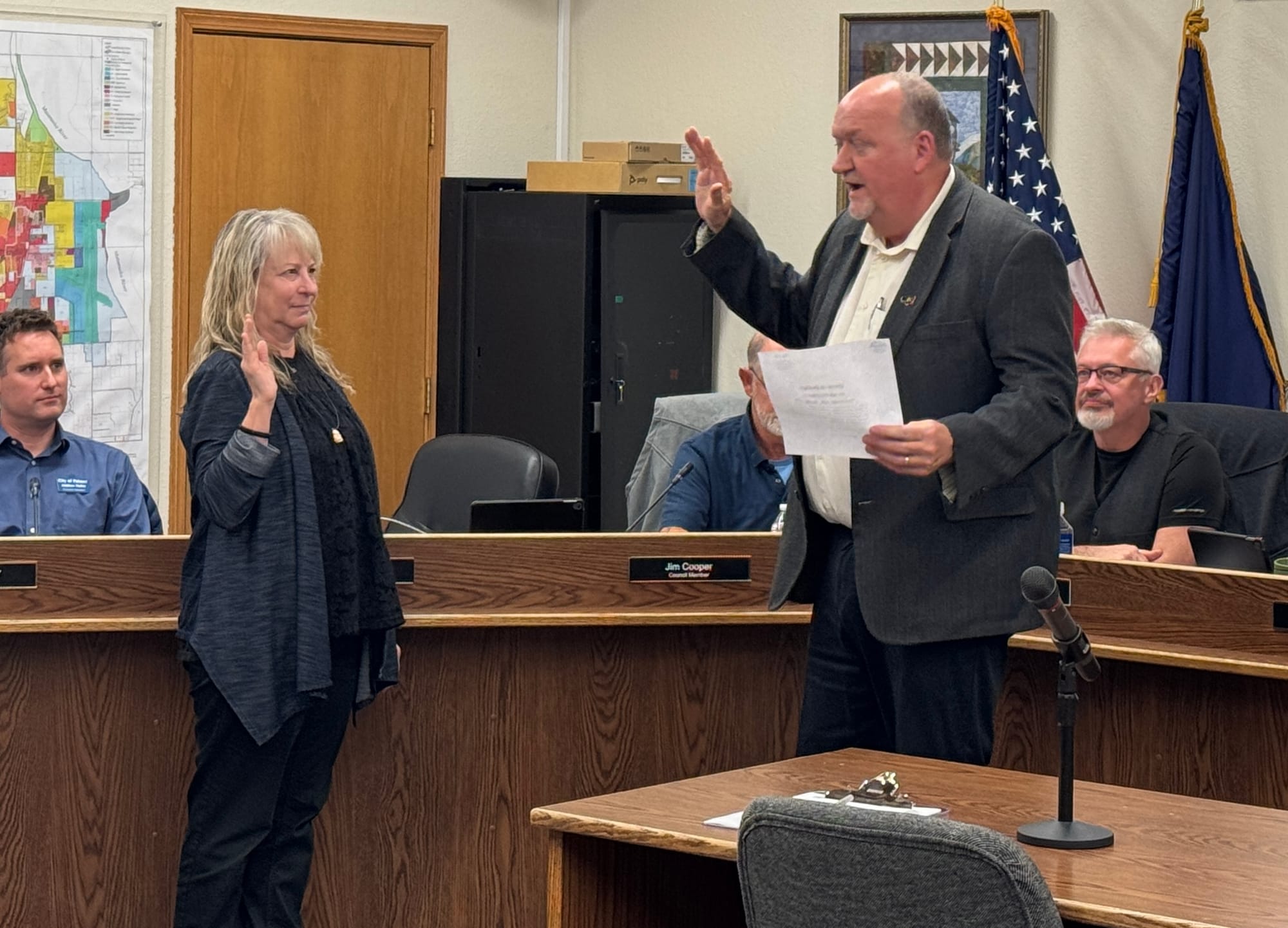 Former Palmer City Clerk Shelly Acteson swears in Council member John Alcantra