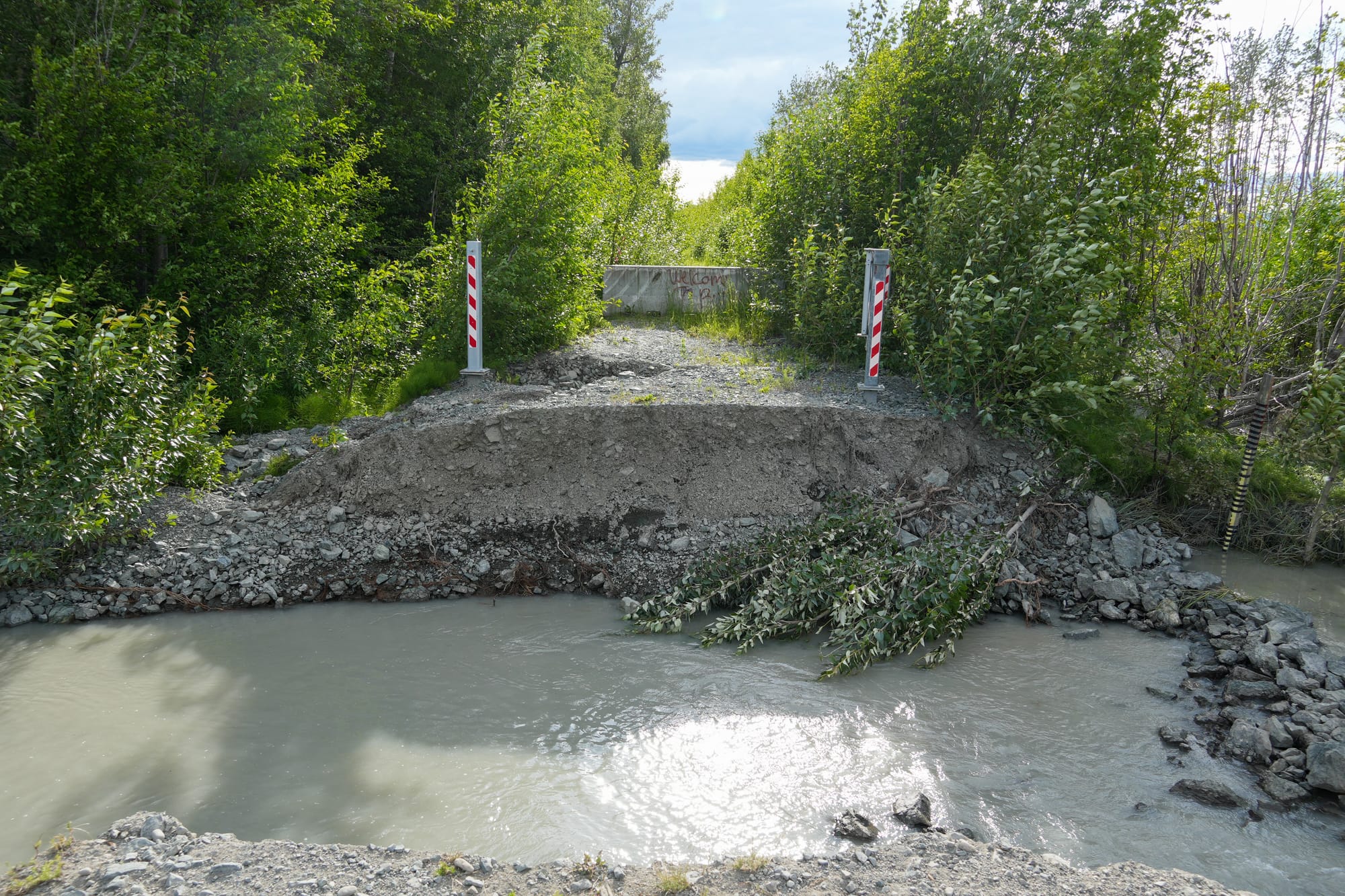 The flow of water against Maud Road