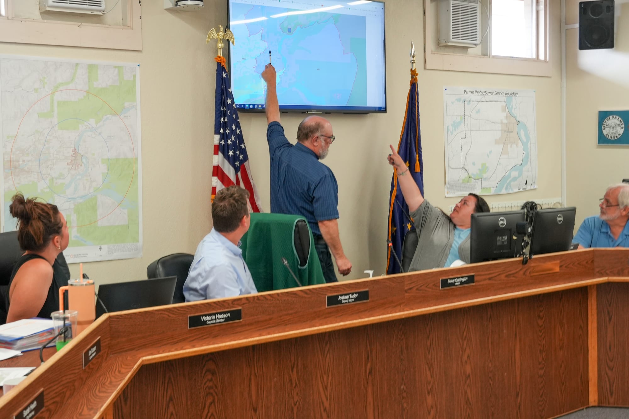 The Palmer City Council, mayor and clerk examine a map.