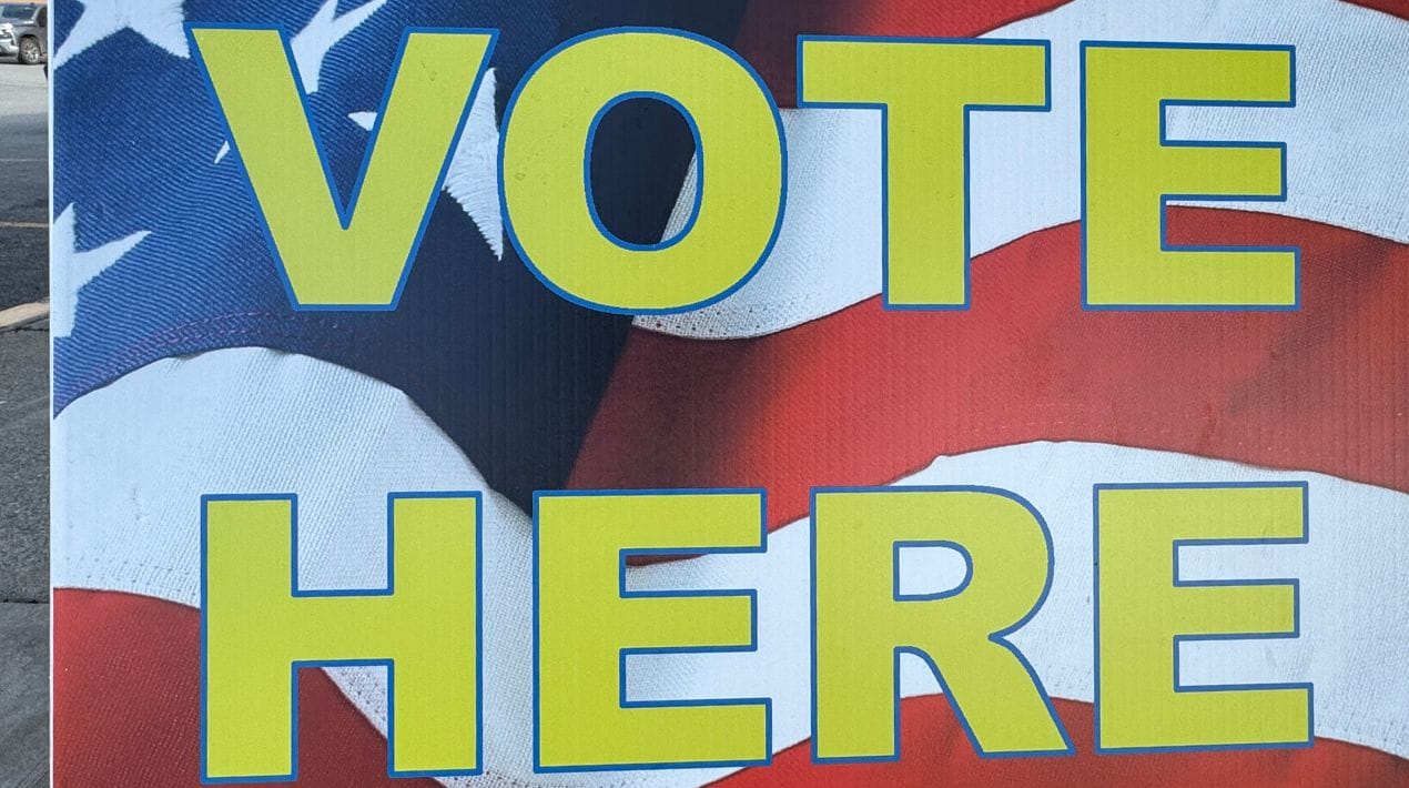 Vote here sign