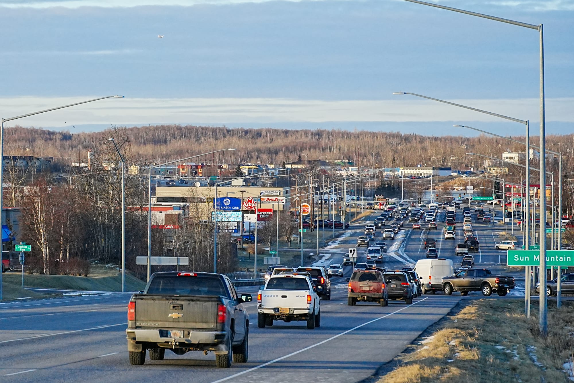 Vehicles travel along the Parks Highway near its intersection with Palmer-Wasilla Highway