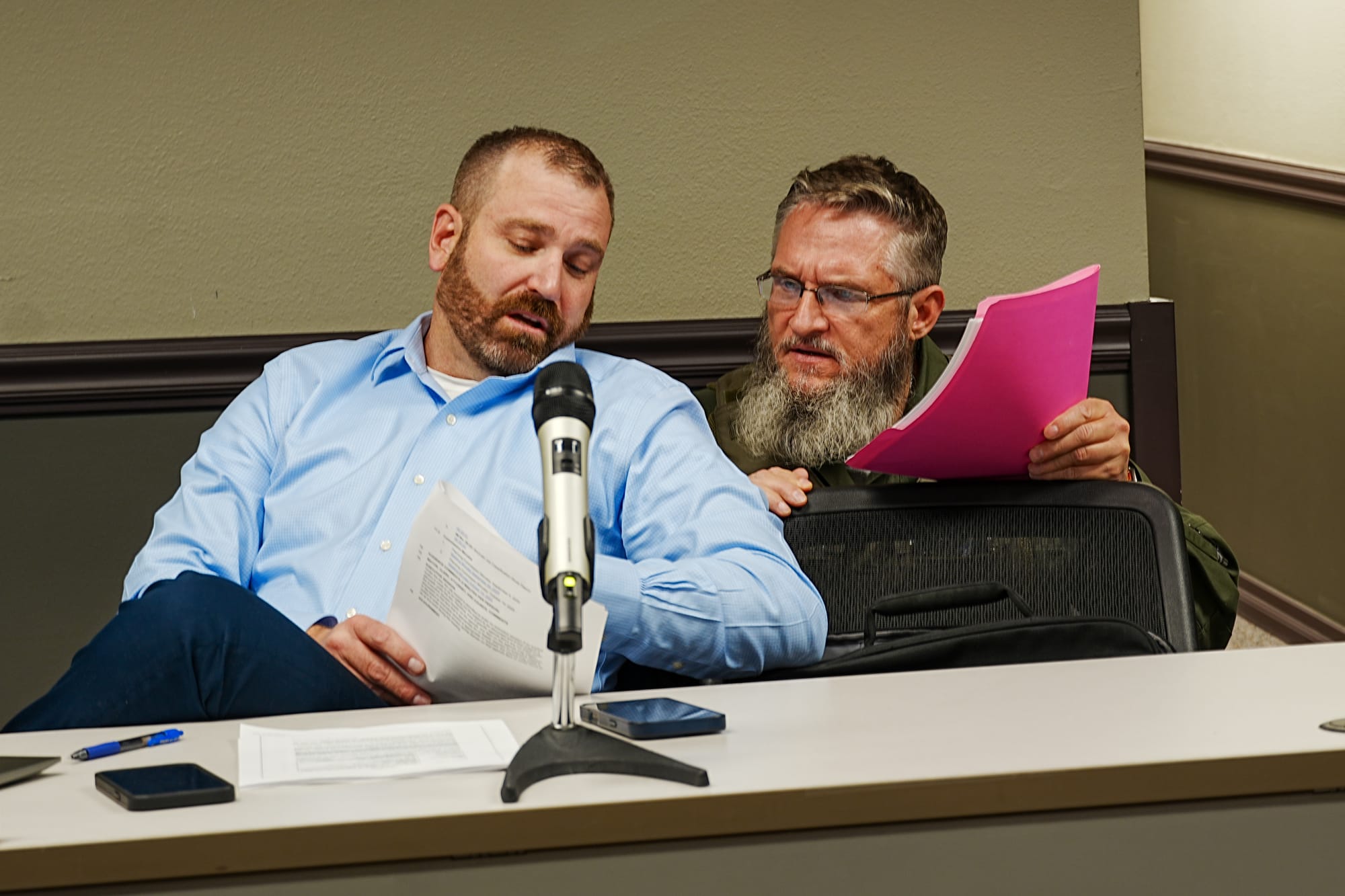 Matanuska-Susitna Borough Chief Animal Control Officer Matthew Hardwig speaks with Wasilla Police Chief William Rapson