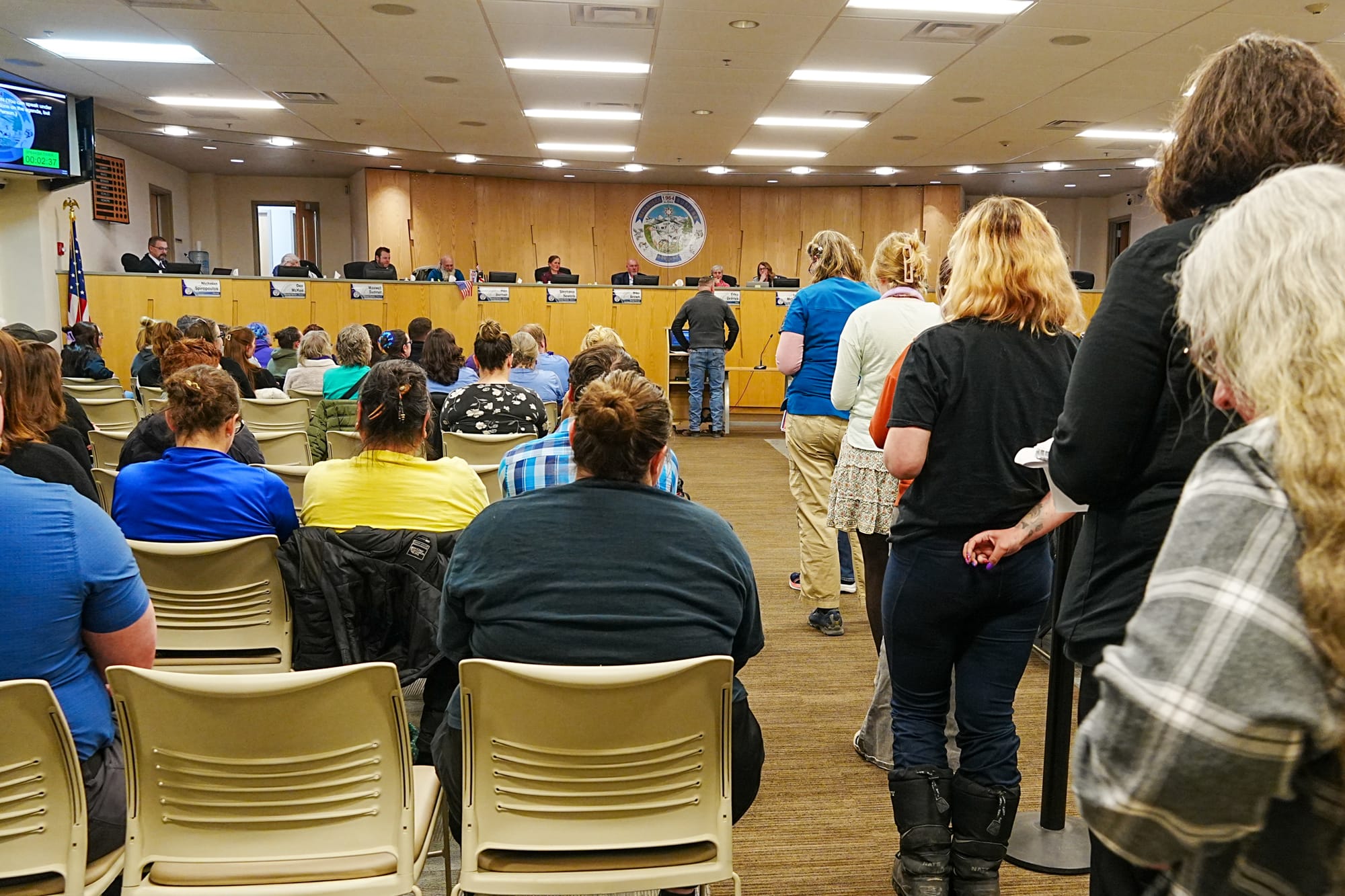 Matanuska-Susitna Borough residents wait in line to speak
