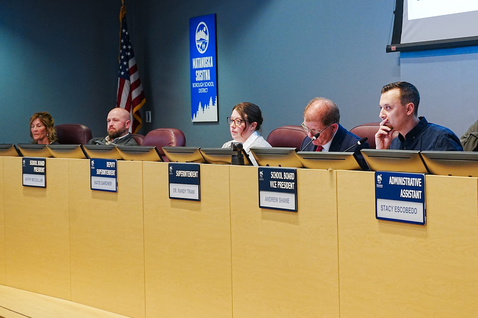 Members of the Matanuska-Susitna Borough School District School Board and school district listen to testimony
