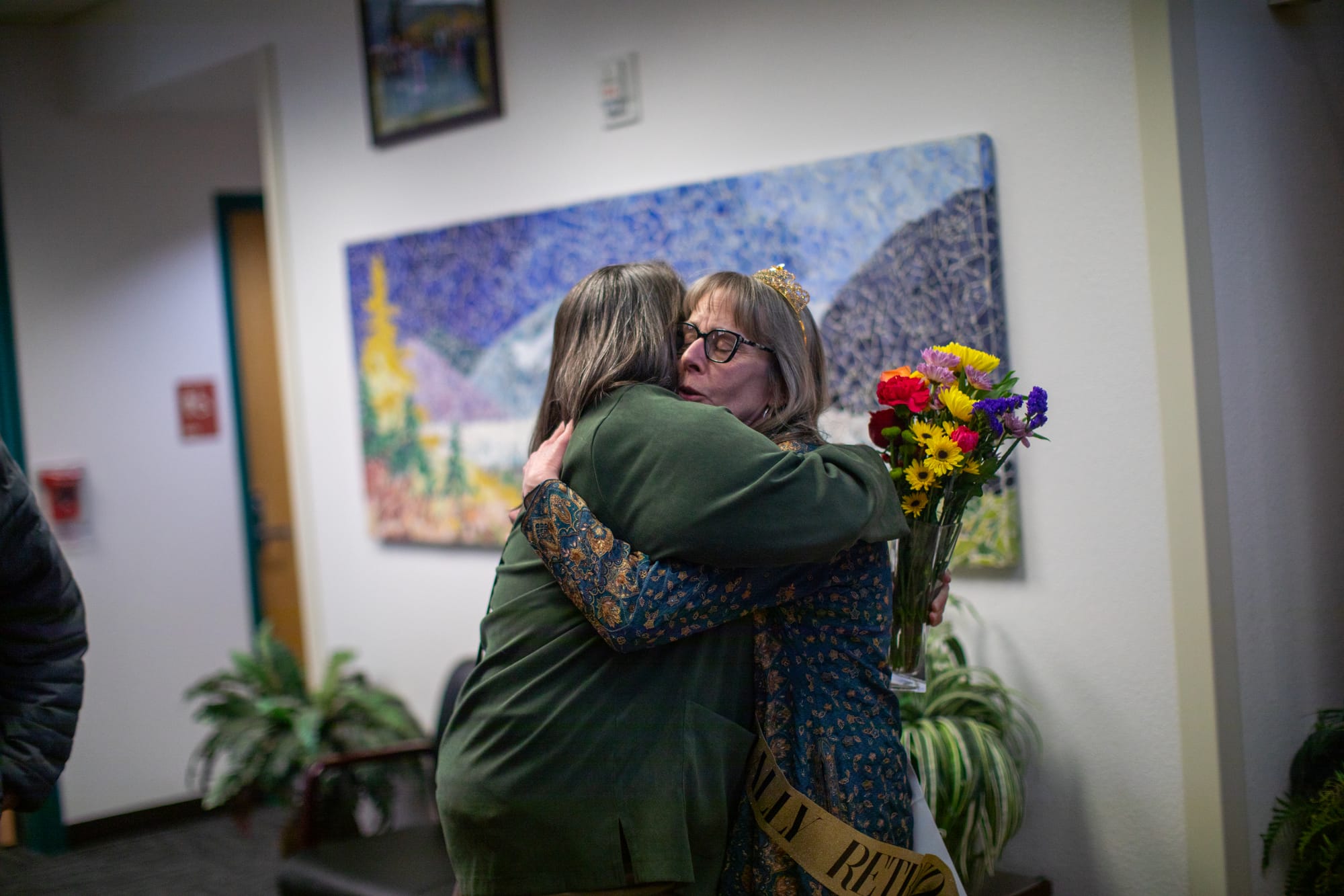 Glacier View Principal Wendy Taylor, right, hugs Becky Hixembaugh