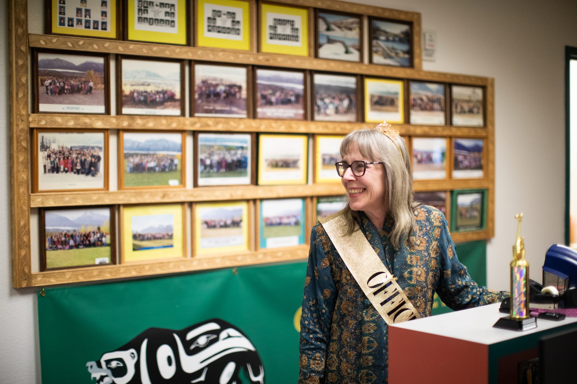 Glacier View School Principal Wendy Taylor smiles while wearing a crown and sash during her retirement celebration