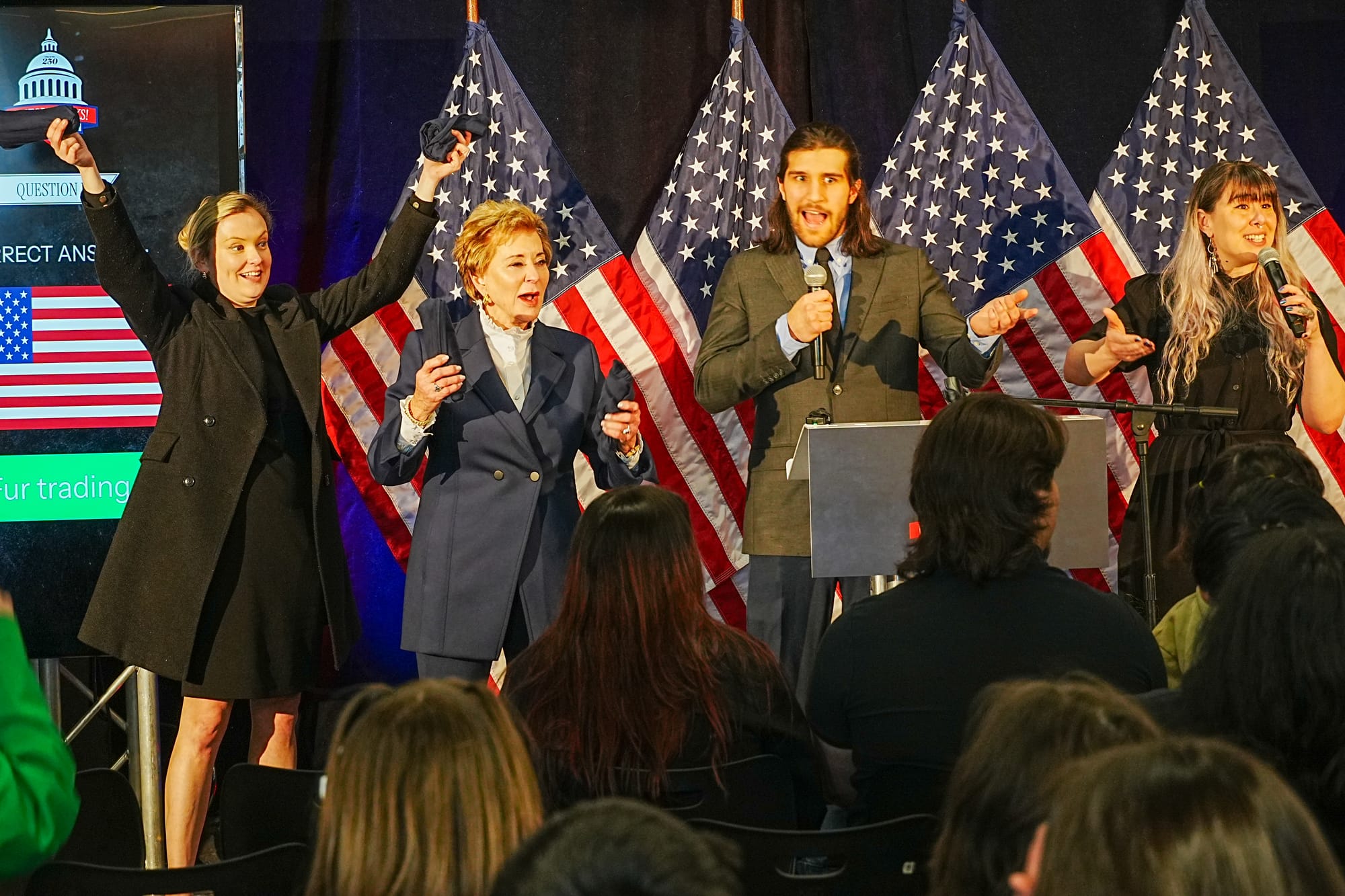 Education Secretary Linda McMahon helps education officials toss out tshirts 
