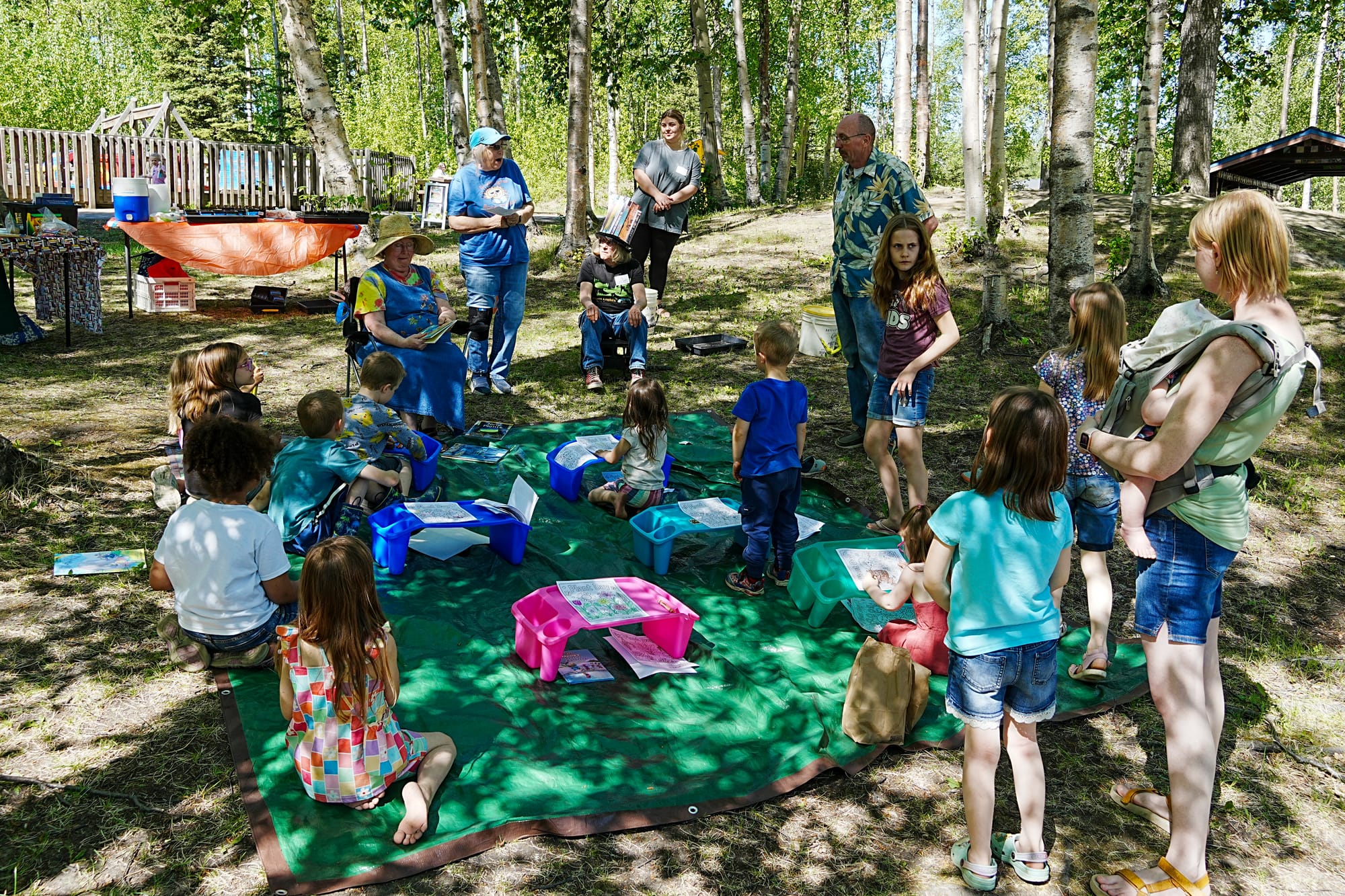 Children gather for the Bright Lights Book Project Summer in the Parks program