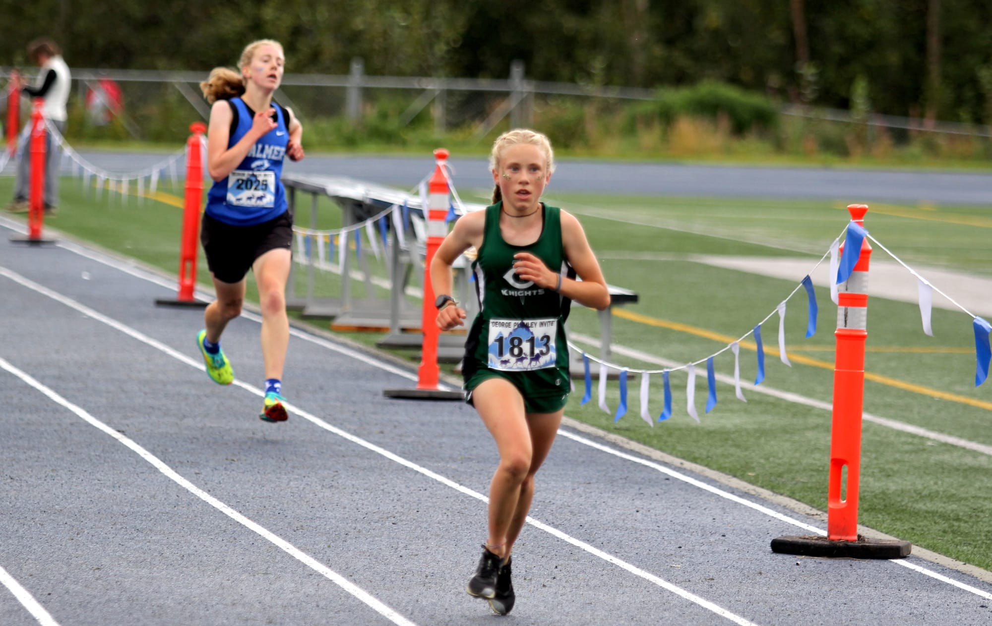 Colony freshman Wren Spangler runs just ahead of Palmer senior Karley Tichenor