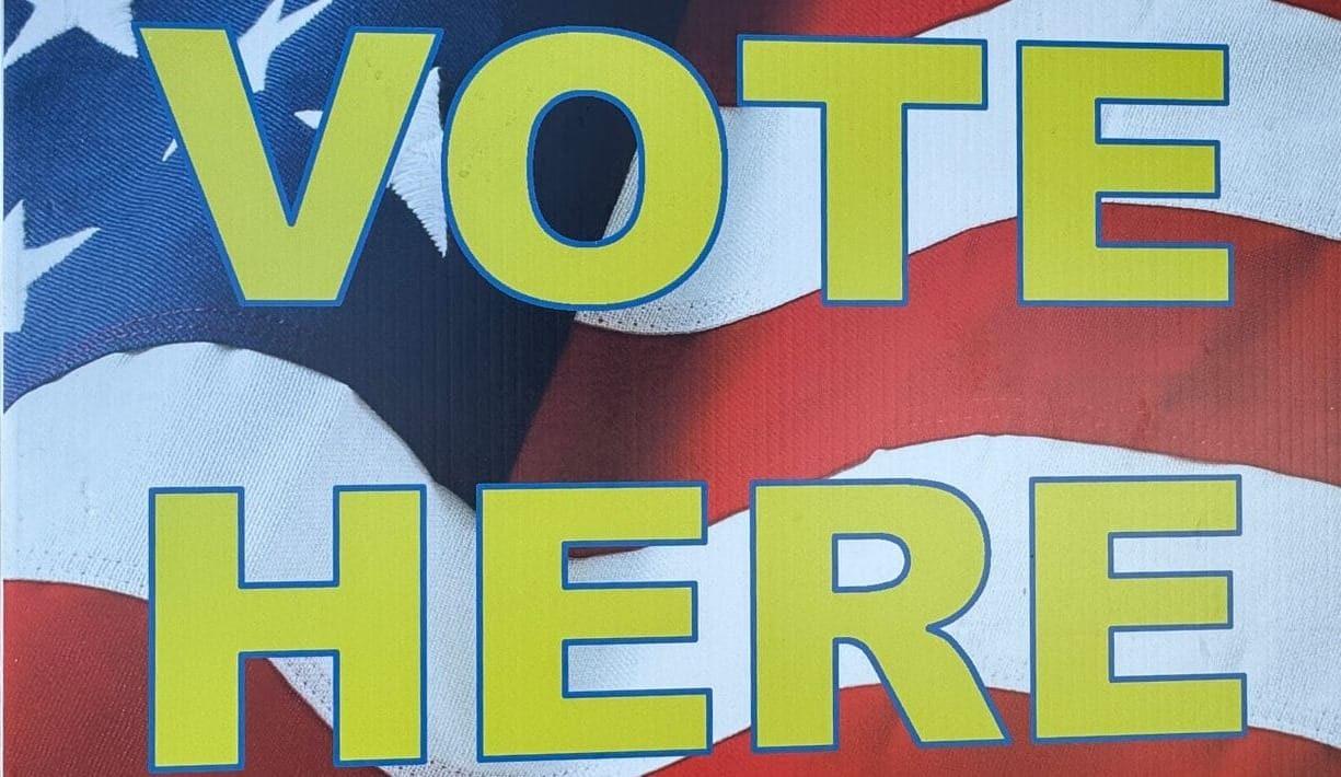 Vote here sign