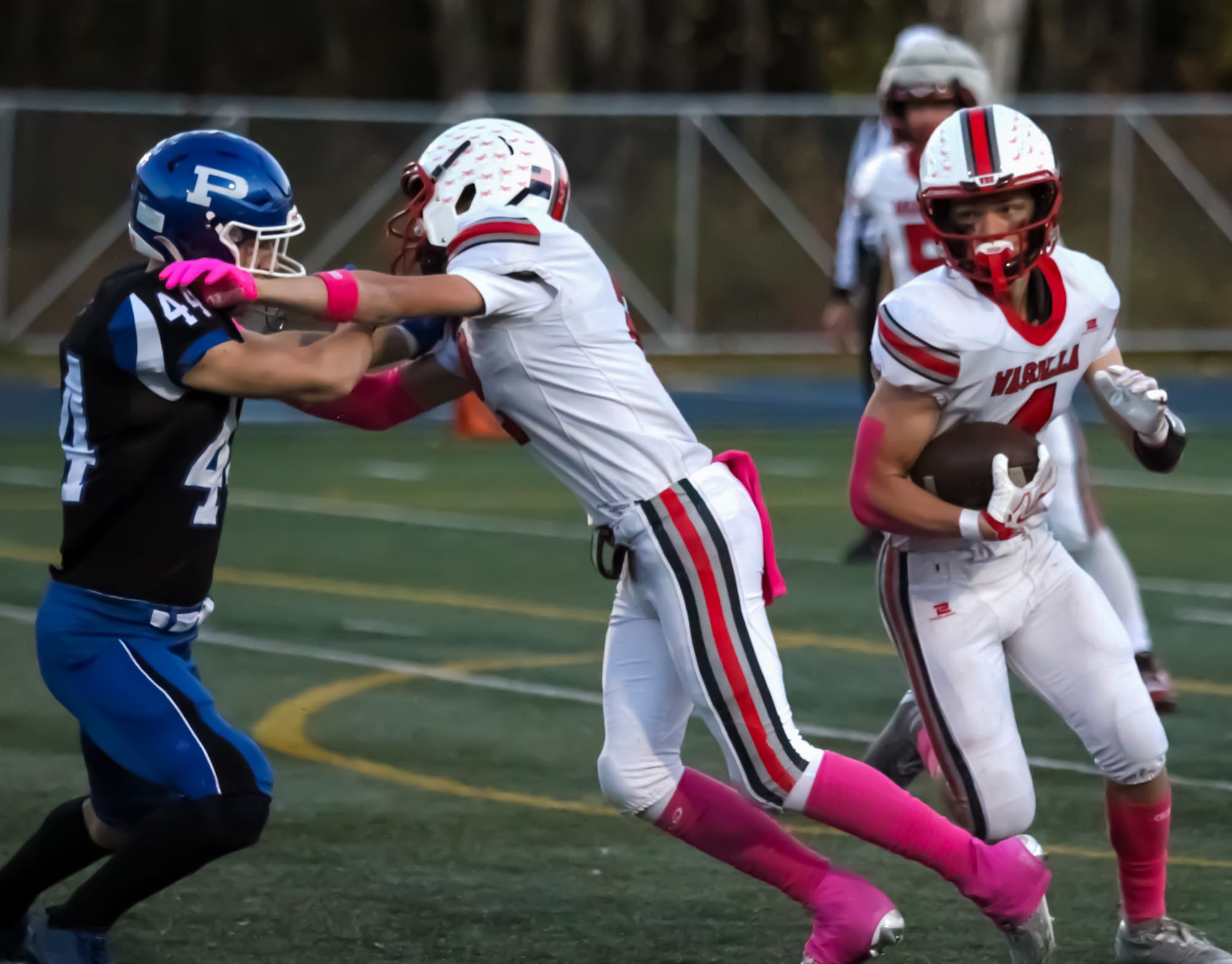 Wasilla senior Brandon Wadleigh follows a block and hits the edge