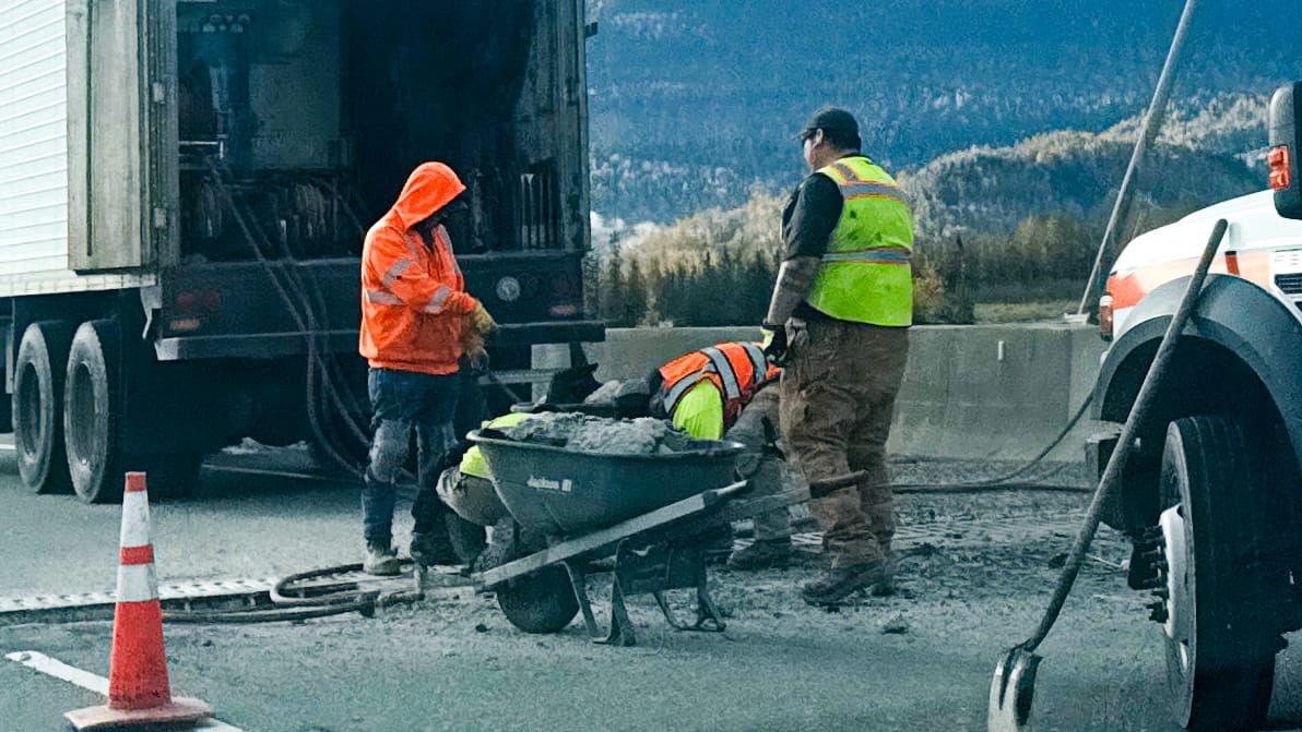 Crumbling concrete against Glenn Highway bridge under repair