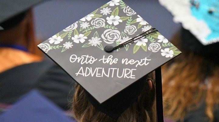 A woman in a graduation cap.