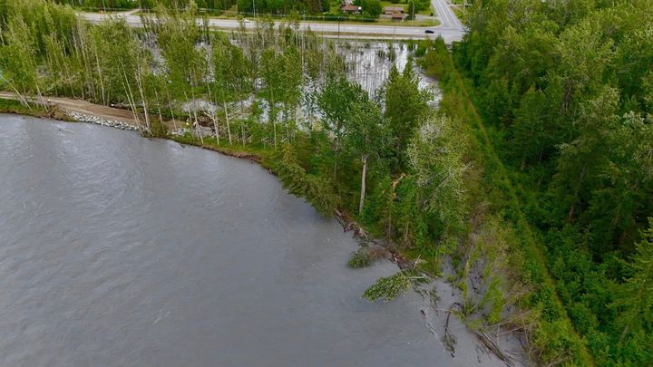 An initial breach along the Matanuska River, shown covered in rock on the left on June 25, 2025, was repaired by state contractors. 