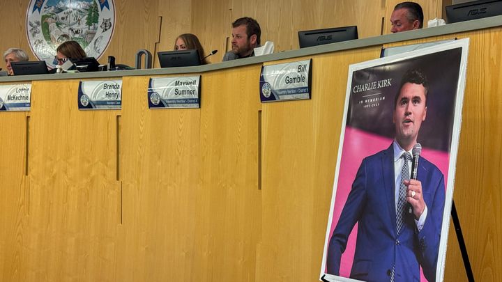 A memorial poster honoring conservative activist Charlie Kirk sits in front of the Matanuska-Susitna Borough Assembly d