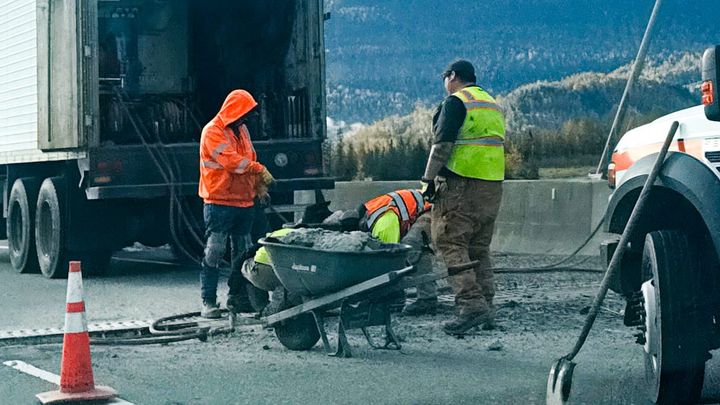 State crews repair concrete against the Matanuska River bridge