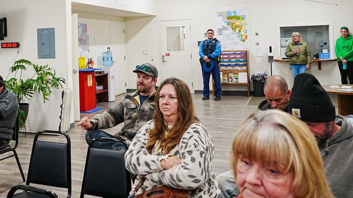 Alaska Trooper Toma Caldarea monitors a Houston City Council meeting