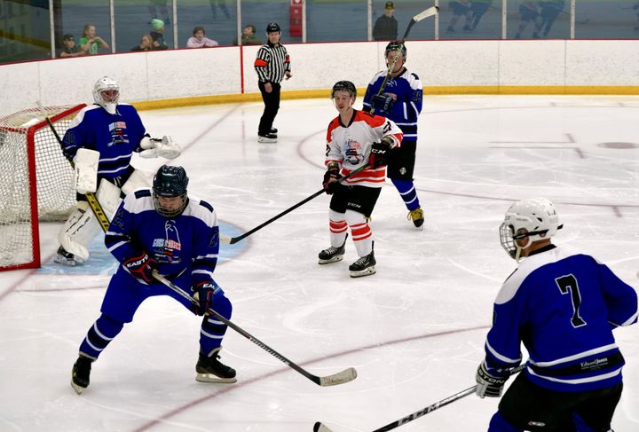 Local police and fire department members participate in the 2024 Guns N' Hoses game