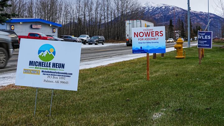 lection signs displayed on Arctic Ave. in Palmer
