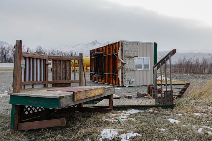 A trailer sits flipped on its side in The Ranch subdivision near Wasilla 