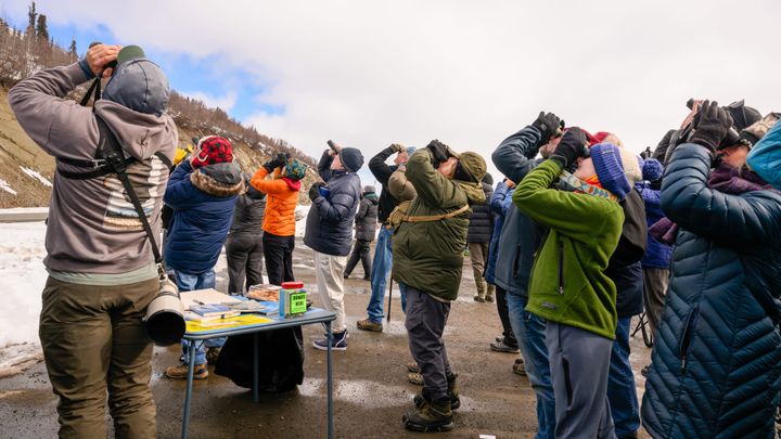 Hawkwatchers spot the first bird of the day during a bird identification lesson 