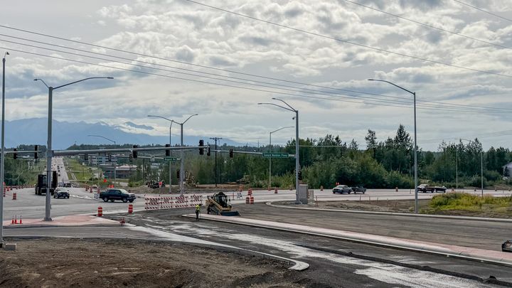 Crews prepare a new section of Seward-Meridian Parkway for asphalt on Saturday, Aug. 15, 2026.