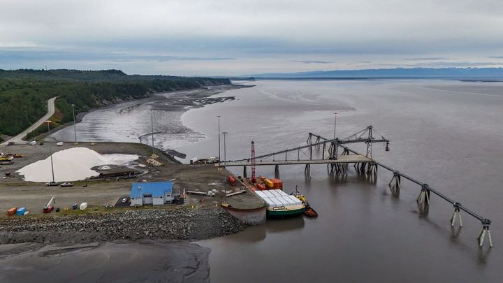 A barge of equipment for an antimony processing plant slated for construction sits docked at Port MacKenzie 