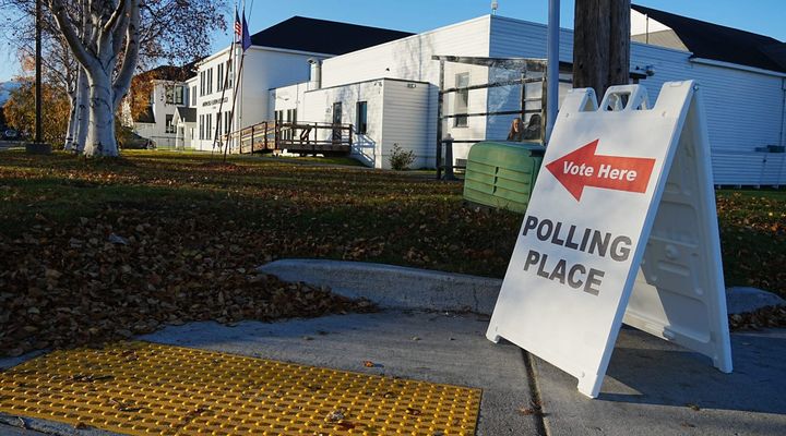 A "vote here" sign sits in front of the Matanuksa-Susitna Borough administration building