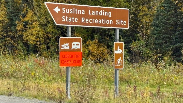A Parks Highway sign points the way to the temporarily closed Susitna Landing State Recreation Site