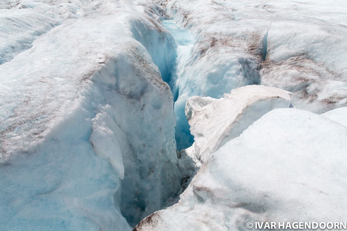 A deep crevasse of melt water on the Athabasca Glacier, Jasper National Park, Canada