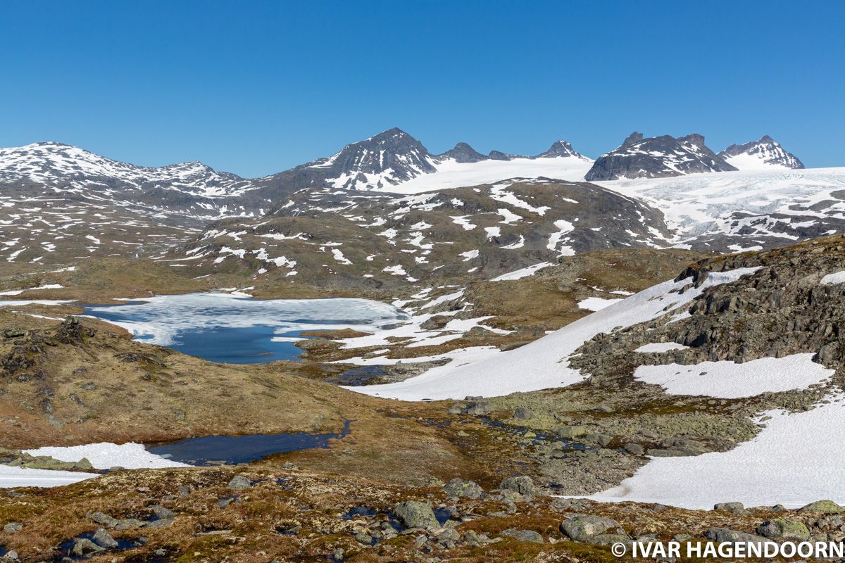 Lakes, glaciers and snow capped mountains near Sognefjellhytta in Jotunheimen National Park, Norway