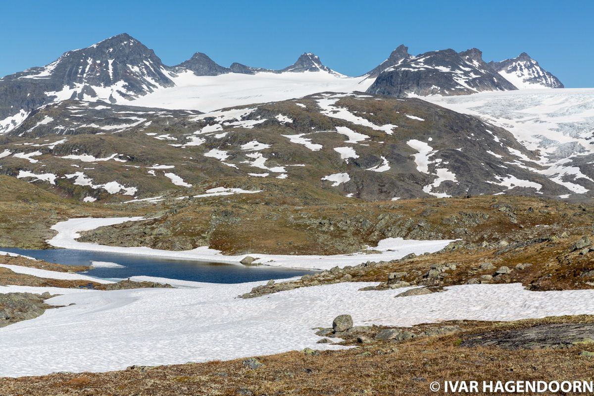Lakes, glaciers and snow capped mountains near Sognefjellhytta in Jotunheimen National Park, Norway