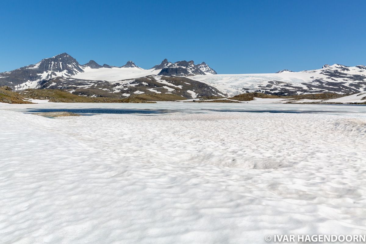Snow covered lake and glaciers near Sognefjellhytta in Jotunheimen National Park, Norway