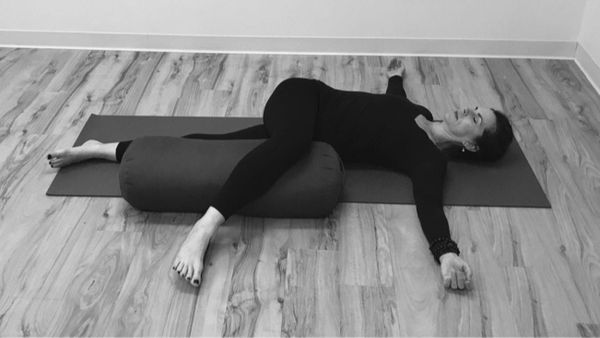 Gentle Supine Spinal Twist: Restorative Yoga with Bolster Support