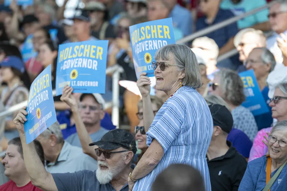 Supporters of Cindy Holscher cheer during the Kansas State Fair debate on Sept. 12, 2026. Holscher is the 2026 Democratic candidate for Kansas Governor. (Dale Grosbach for Citizen Journal)