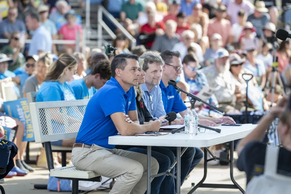 Left to right: Michael Schwanke of KWCH-TV, Donna Sullivan of Grass and Grain, and Tim Carpenter of Kansas Reflector pose questions of gubernatorial candidates at the Kansas State Fair debate on Sept. 12, 2026. The debate was organized by WIBW-AM and moderated by Greg Akagi. (Dale Grosbach for Citizen Journal)