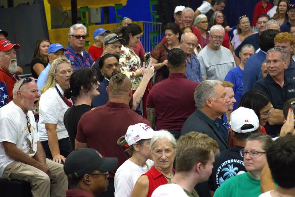 A protester is removed by security during a rally featuring Vice President JD Vance in Olathe, Kan. on Sept. 14, 2026. The protester claimed to be a journalist, although they were not credentialed by the PAC running the event. (Matthew Petillo/Citizen Journal)