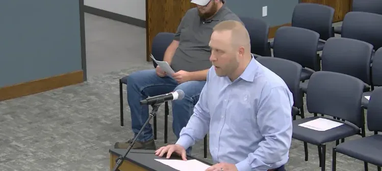 Josh Bedel, general manager of the McPherson Board of Public Utilities, addresses county commissioners Sept. 28. He said the proposed sound limits would block expansion of Power Plant 3, raise electric rates and impose standards neither existing nor new industries could meet. (cj screenshot)