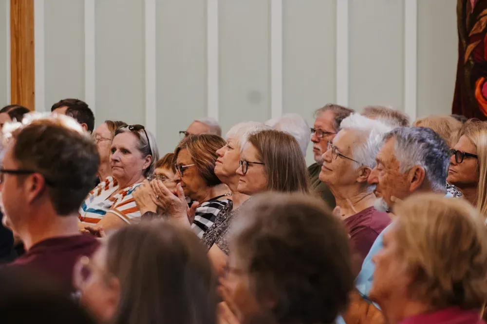 Supporters of Adam Hamilton, Democratic candidate for U.S. Senate, watch him speak during an event at Bethany College in Lindsborg, Kan. on Oct. 8, 2026. (Riya Casper for Citizen Journal)