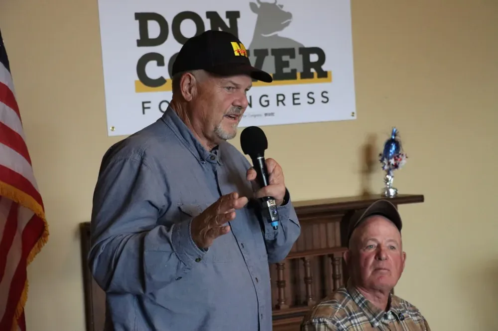 Former Sen. Jon Tester, D-Mont., left, speaks at an event for Don Coover, right, who is running as a Democrat in Kansas' 2nd Congressional District, in Leavenworth, Kan., on Monday, Oct. 19, 2026. (Matthew Petillo/Citizen Journal)