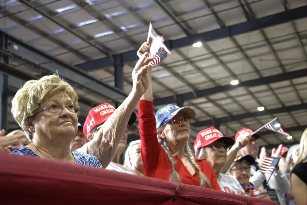 Supporters wave American flags while Vice President JD Vance speaks in Topeka, Kan., on Monday, Oct. 26, 2026. (Matthew Petillo/Citizen Journal)