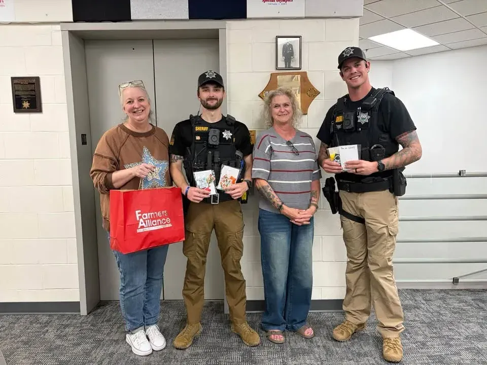 Farmers Alliance brings treat bags to McPherson County Law Enforcement Center