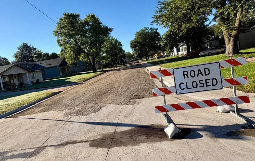 Final paving begins on North Elm Street's 1100 block after extended reconstruction
