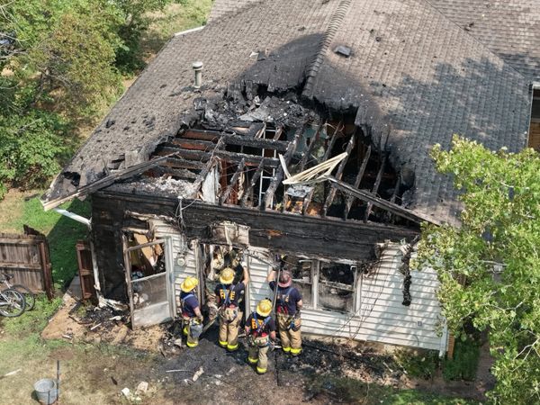 Unoccupied Hutchinson house damaged in fire, downed power line blocks initial access