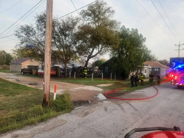 Hose lines kept West Avenue A garage fire from taking the house next door