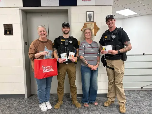 Farmers Alliance brings treat bags to McPherson County Law Enforcement Center