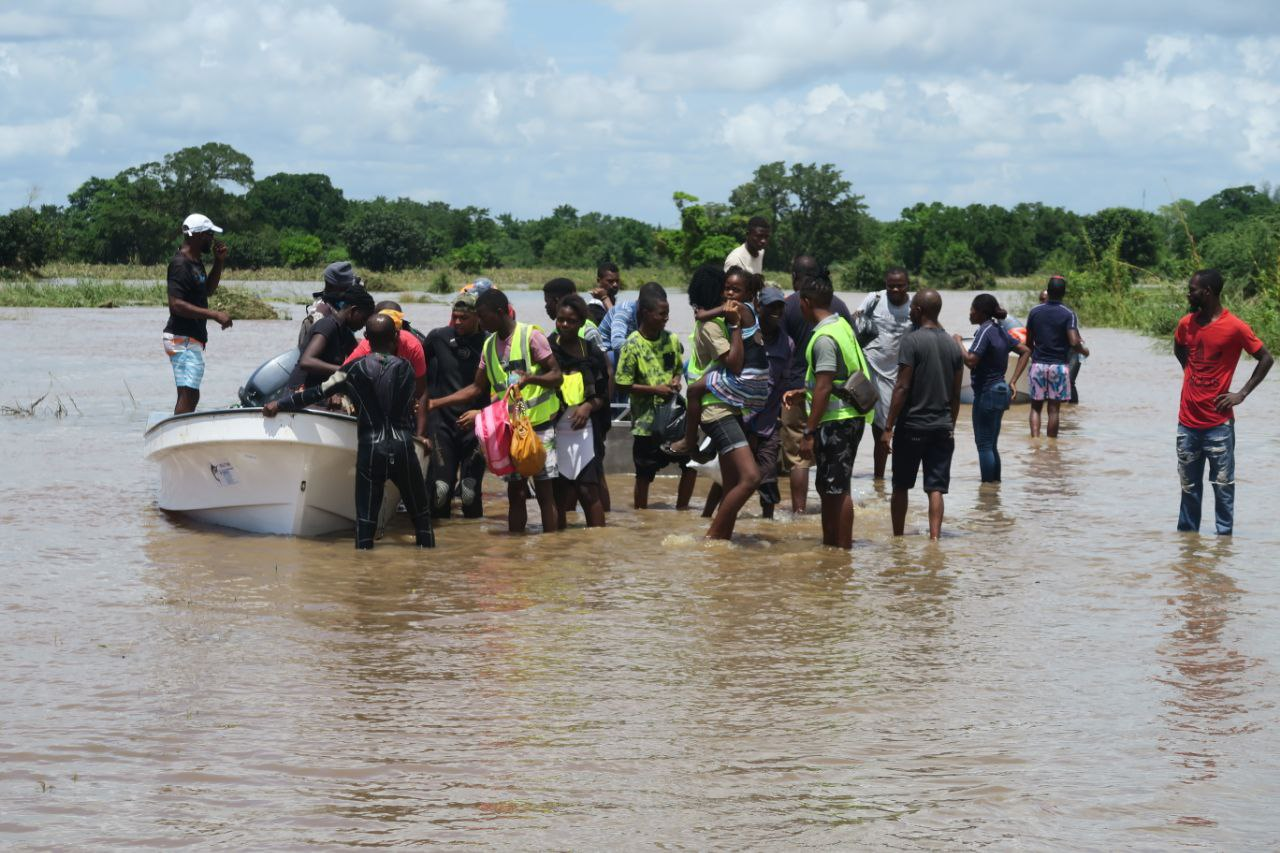 Boats rescue people trapped by floods in Boane, Maputo province